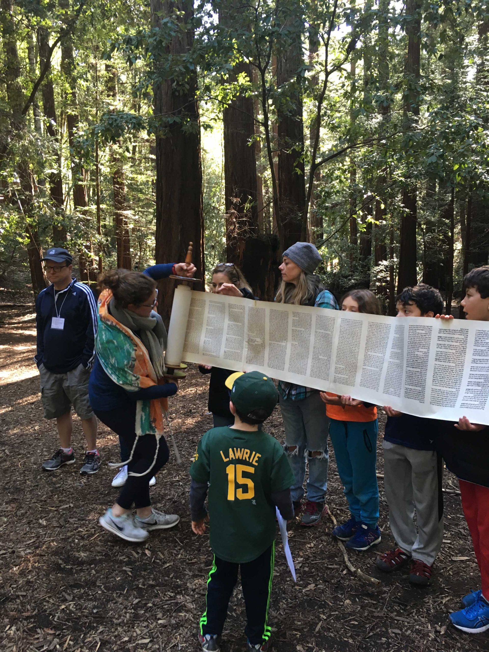 Rabbi Alissa Forrest Miller and Kulanu participants unroll the Torah